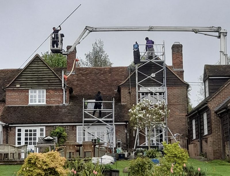 The Roof Moss Cleaners using cherry picker and scaffolding to clean roof safely and professionally in Shipston-on-Stour, Warwickshire